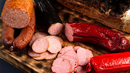 Assortment of cured meats on a cutting board