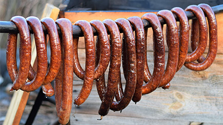 Hanging delicious smoked sausages