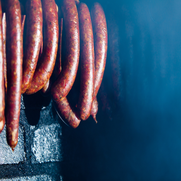 Sausage hanging in a smoker