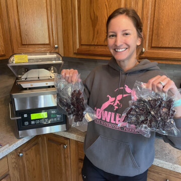 Sallie Doty holding sealed jerky with the chamber sealer