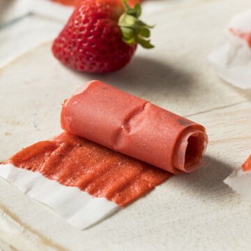 Strawberry fruit leather rolled on baking sheet