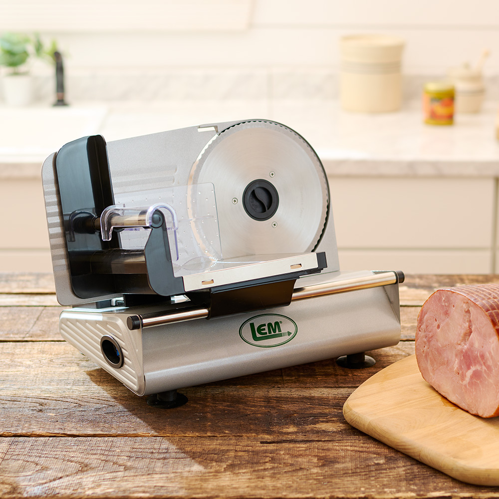 LEM Meat Slicer on counter with sliced ham
