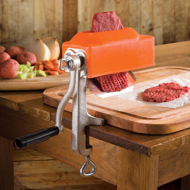 crank meat tenderizer clamped to a table