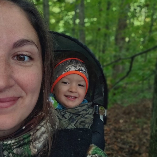 Beka Garris with daughter hunting in woods