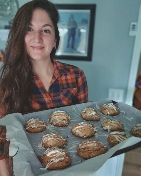 Beka Garris with holding pan of persimmon cookies
