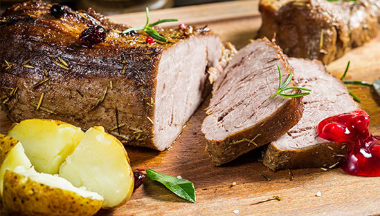 Delicious sliced roast on a cutting board